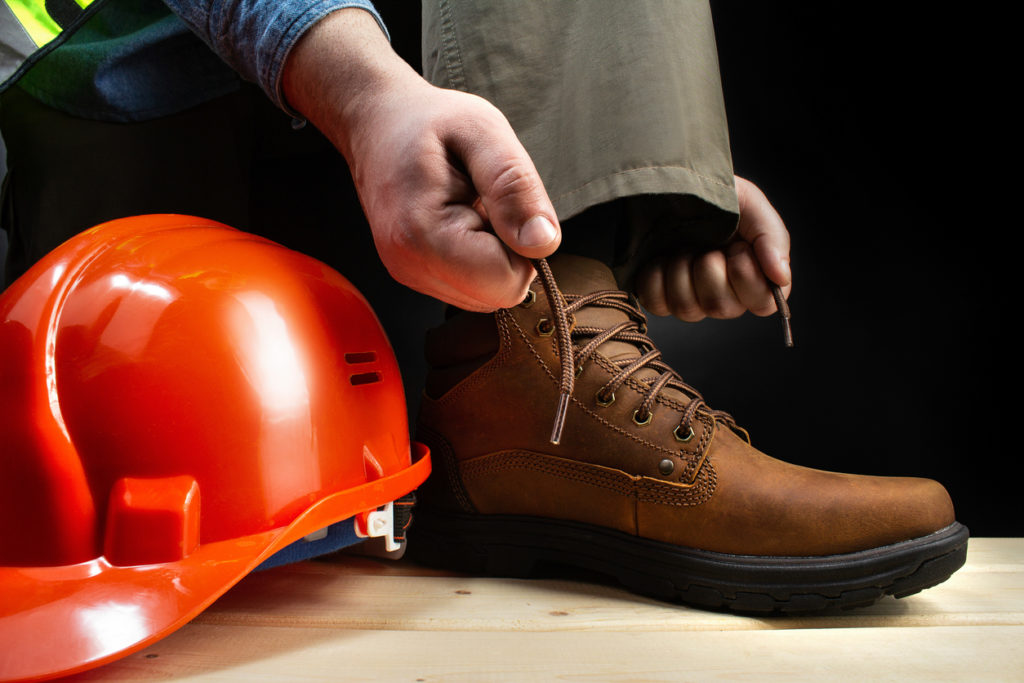 Brown safety boots with helmet and hi vis jacket