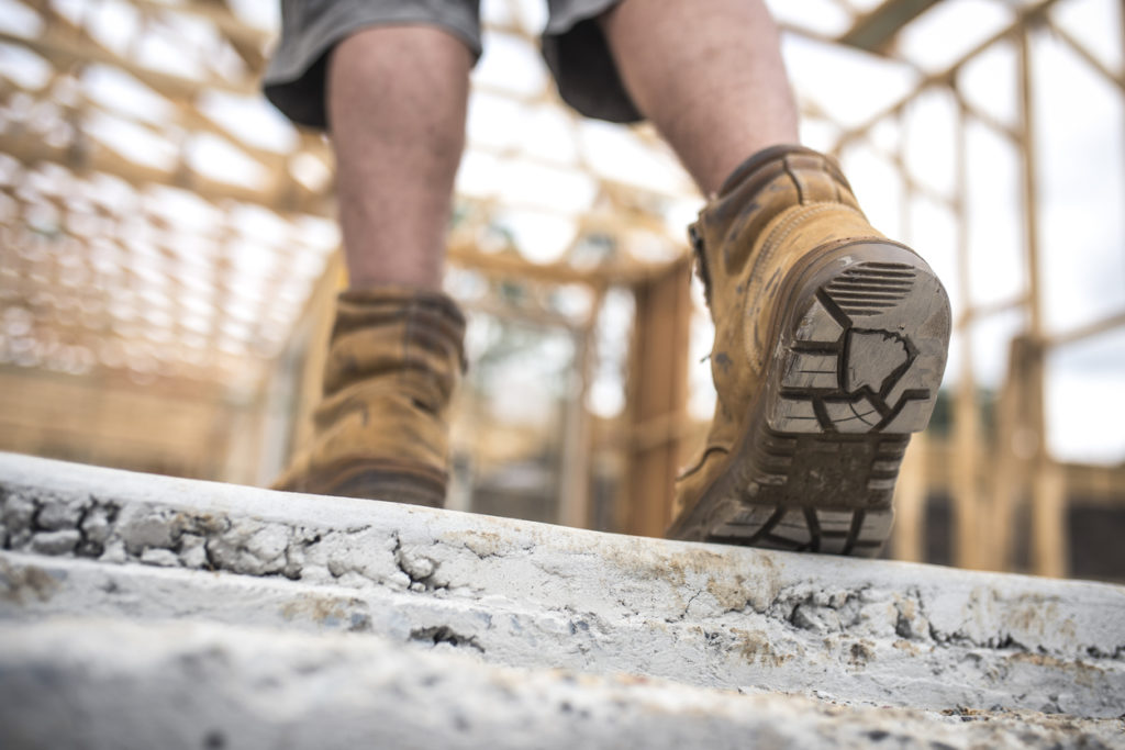 Safety Footwear walking on construction site